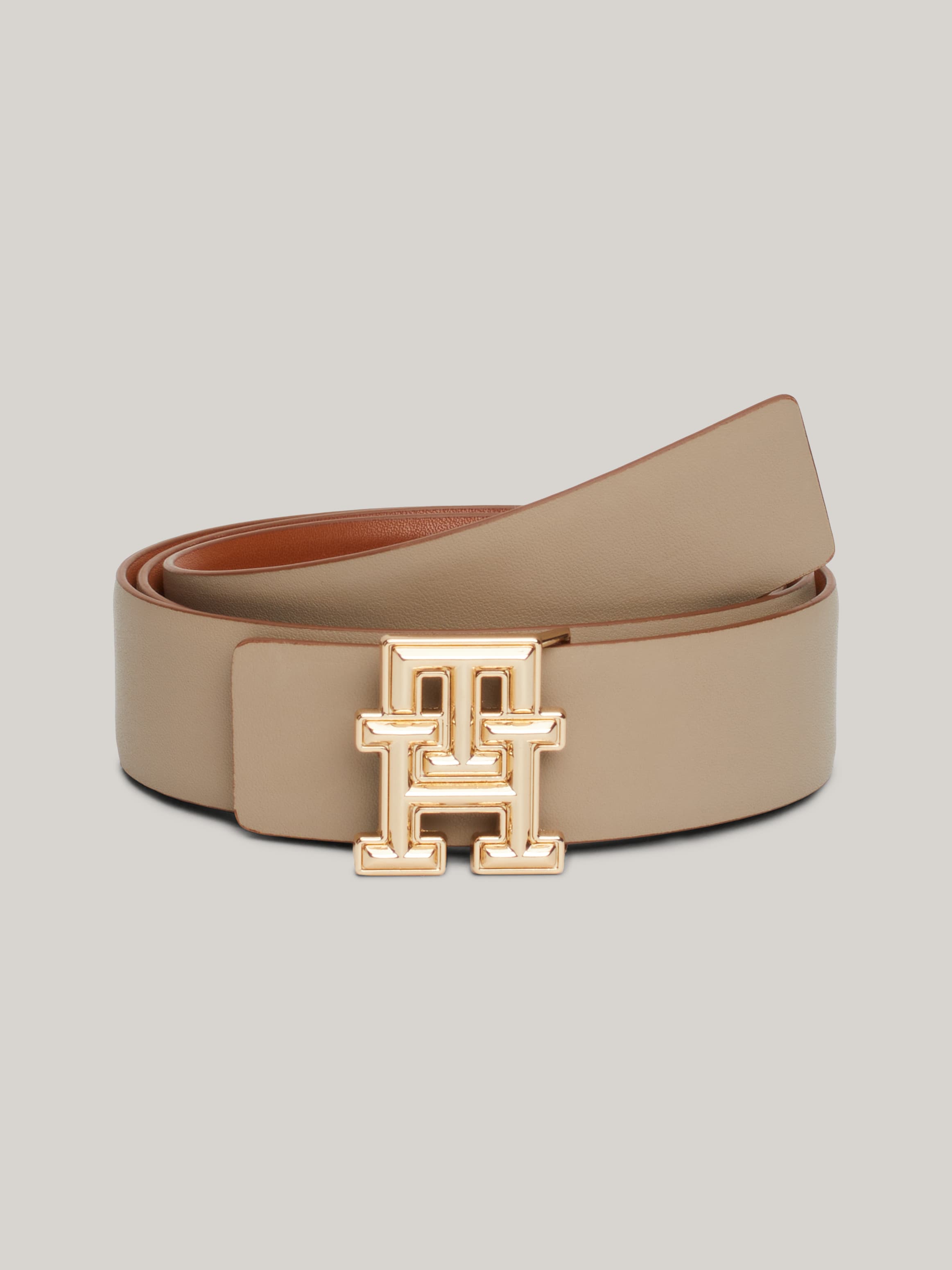 حزام جلد بوجهين مزين بالشعار